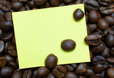 White paper sheet on the background of coffee beans. Label for your individual text.の写真素材