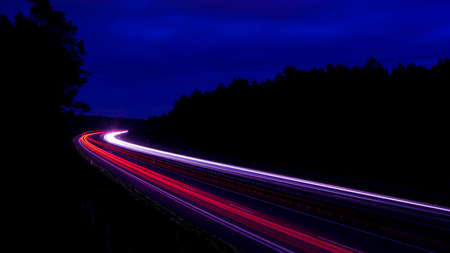 Night road lights. Lights of moving cars at night. long exposure multicolored