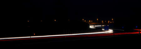 Night road lights. Lights of moving cars at night. long exposure red, blue, green