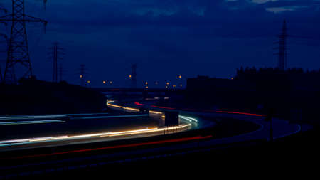Night road lights. Lights of moving cars at night. long exposure red, blue, green