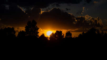 sunset with clouds in the background