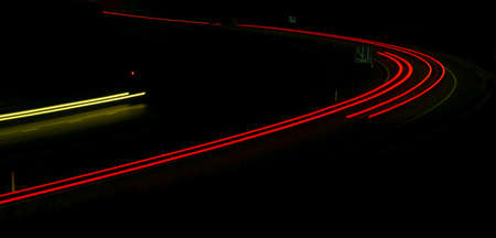 Night road lights. Lights of moving cars at night. long exposure red, blue, green