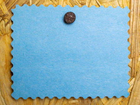 blue blank note pinned nail to boardの写真素材