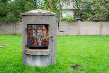 manual backyard well on the background of the lawnの写真素材