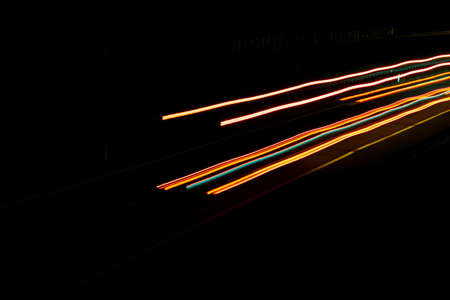 Night road lights. Lights of moving cars at night. long exposure red, blue, green