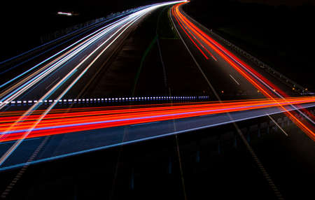 Night road lights. Lights of moving cars at night. long exposure red, blue, greenの写真素材