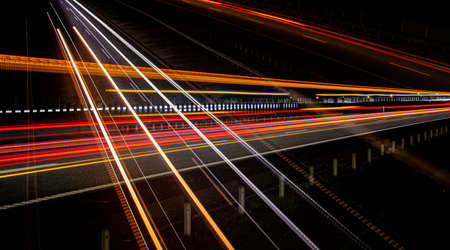 Night road lights. Lights of moving cars at night. long exposure red, blue, green