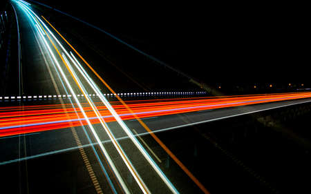 Night road lights. Lights of moving cars at night. long exposure red, blue, greenの写真素材