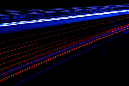 Night road lights. Lights of moving cars at night. long exposure red, blue, green