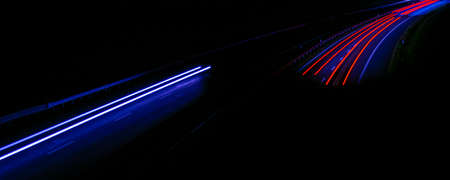 Night road lights. Lights of moving cars at night. long exposure red, blue, green, orange.
