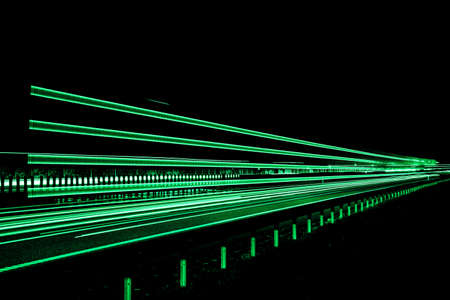 Night road lights. Lights of moving cars at night. long exposure red, blue, greenの写真素材