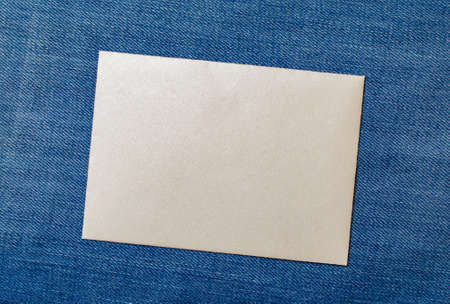 white envelope blank note pinned to a blue notice board