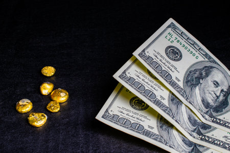 golden buttons, nuggets on a black background. gold recoveryの写真素材