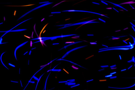 Luminous multicolored wavy lines on a black background