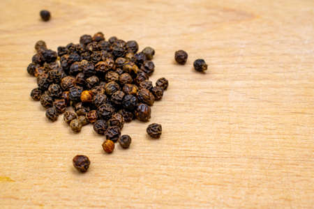 black peppercorns on a white backgroundの写真素材