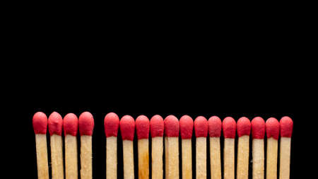 matches in a row on a black background.の写真素材