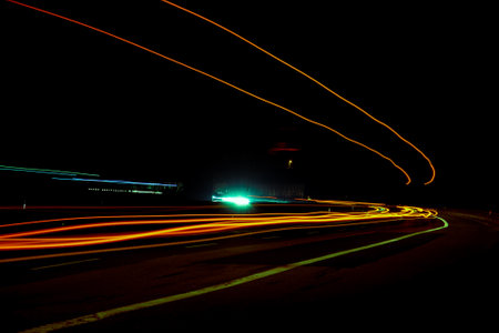 Night road lights. Lights of moving cars at night. long exposure red, blue, green