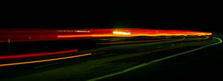 Night road lights. Lights of moving cars at night. long exposure red, blue, green