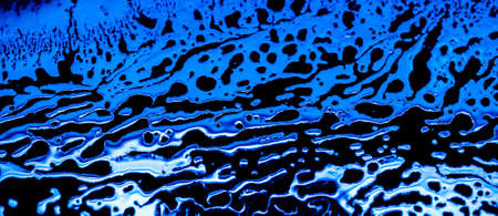 silvery stains on a black background