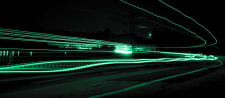 Night road lights. Lights of moving cars at night. long exposure red, blue, greenの写真素材