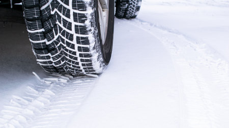car wheel in the snow, traces of tires