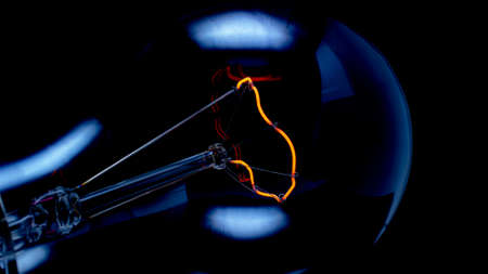 incandescent filament in the dark. photo into a decorative painting