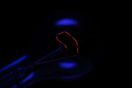 incandescent filament in the dark. photo into a decorative paintingの写真素材