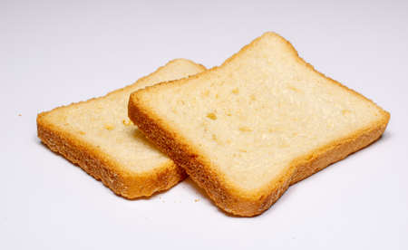 slices of rusks on a white background