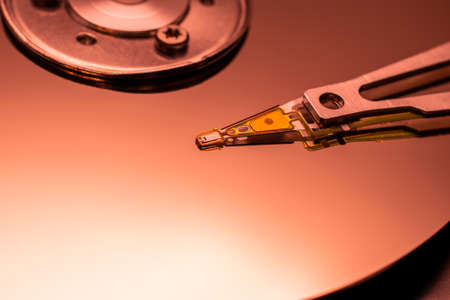 closeup hard drive, platter and head, background