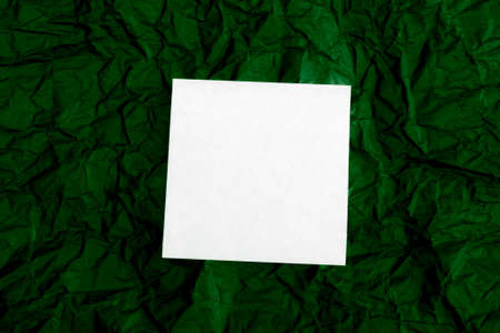 white blank note on crinkled notice boardの写真素材
