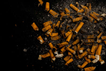 Cigarette butts thrown in the ashtrayの写真素材
