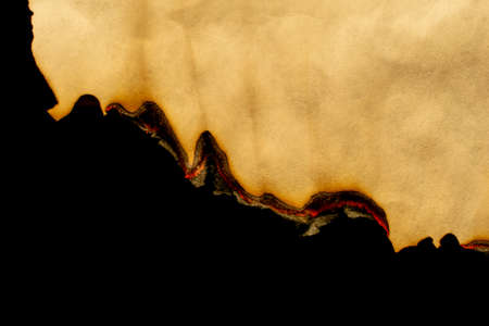 burnt edge of old paper on black backgroundの写真素材