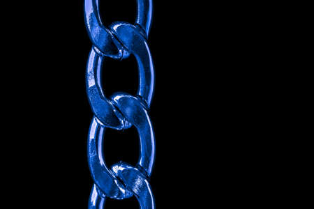 blue chain links on black background.