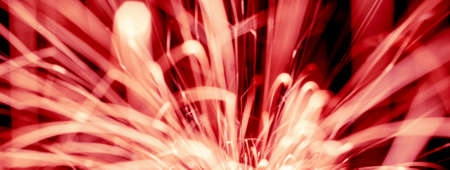 lines of light. sparks in the darkの写真素材