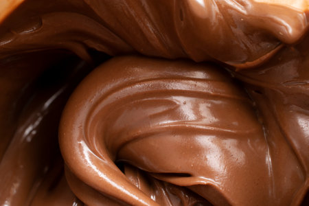 melted chocolate pouring and stirringの写真素材