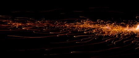 fire in dark. luminous lines of sparks. explosion black powder.