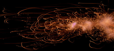 fire in dark. luminous lines of sparks. explosion black powder.の写真素材
