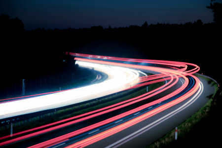 Night road lights. Lights of moving cars at night. long exposure