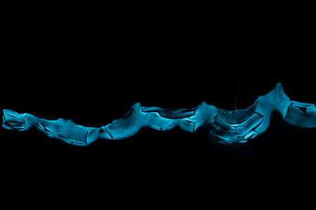 burning paper, glowing edge of paper on a black background