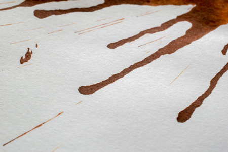 brown coffee stains on white paperの写真素材