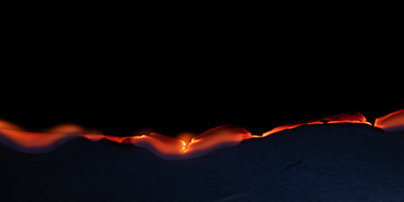 burning paper, glowing edge of paper on a black background