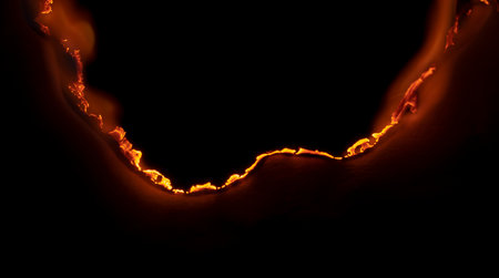 burning paper, glowing edge of paper on a black background