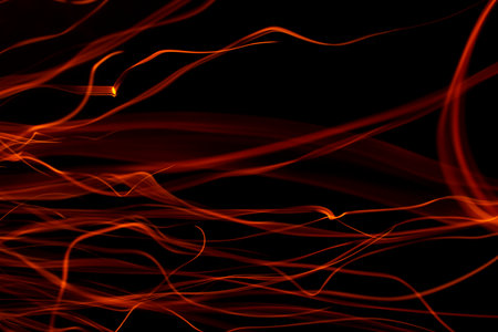 light ribbons of sparks on a black background, long exposureの写真素材
