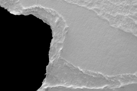 edge of a torn white sheet of paper on a black background, black hole