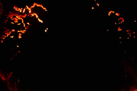 burning paper, glowing edge of paper on a black background