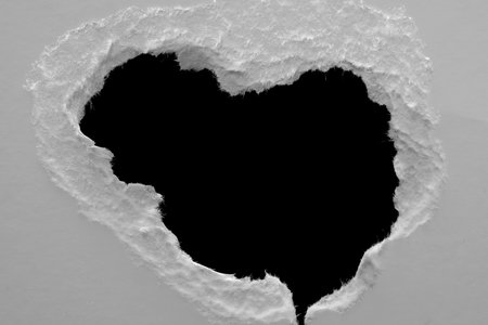 edge of a torn white sheet of paper on a black background, black holeの写真素材