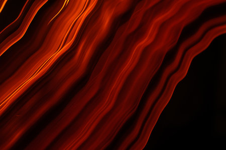 burning paper, glowing edge of paper on a black background