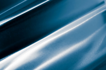 bent metal sheet with visible texture. backgroundの写真素材