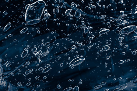 air bubbles in water. dark space background