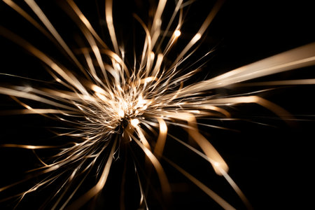 sparks from the grinder glowing in the dark straight aheadの写真素材